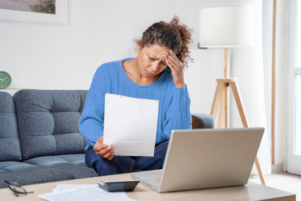 Worried Woman Reading Her Notice to Vacate